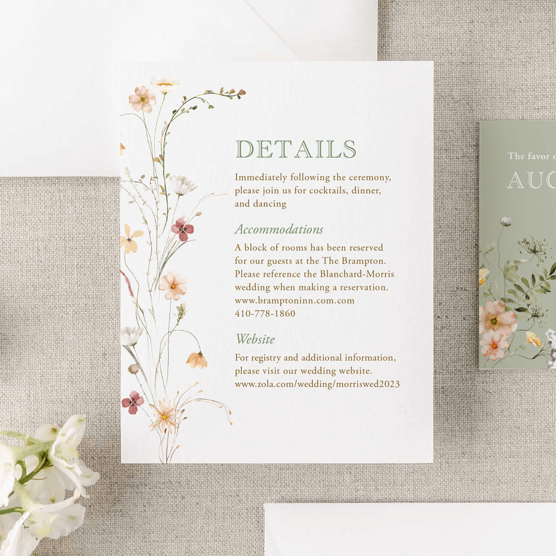 wedding details card with floral accents