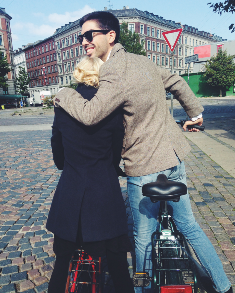 loving couple embrace while bike riding