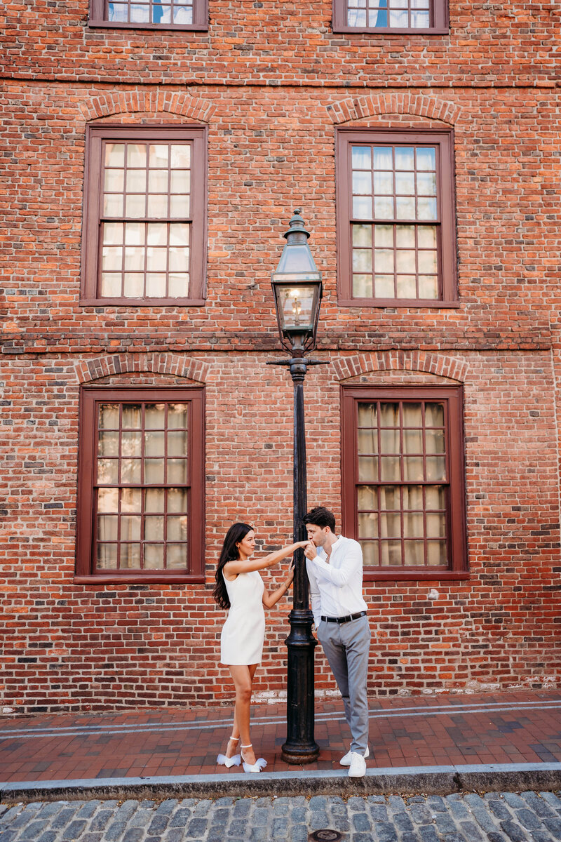 The charm of Boston’s North End provides the perfect setting for this engagement session, where city life meets timeless romance in every frame.