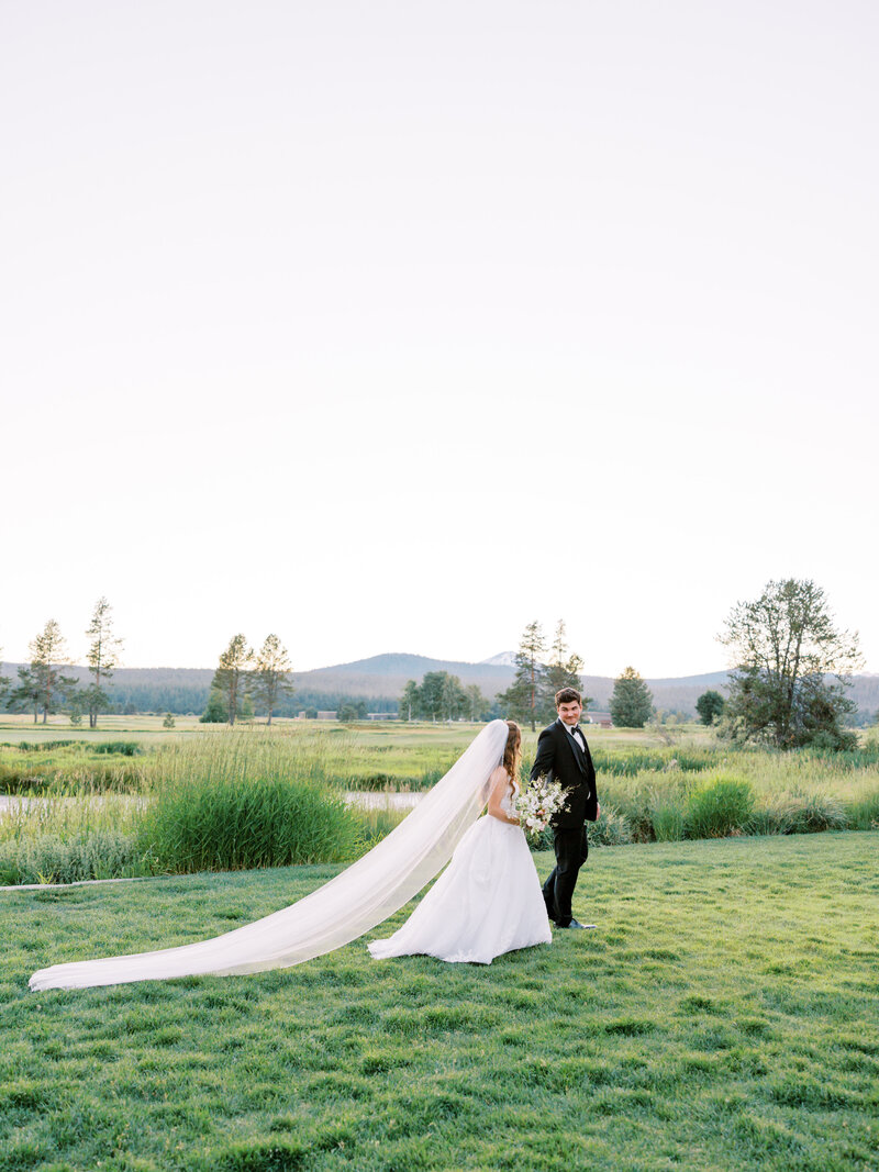 Couple walking into the sunset at Sunriver Resort