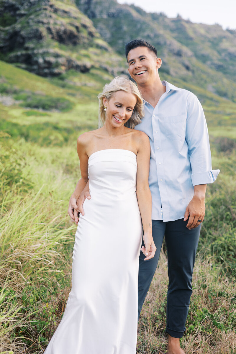 Elopement Photography, couple walking and smiling in a large field