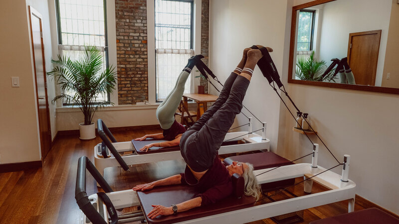 Clients moving on the reformer during in a Next Level class at Craft Pilates studio in Brooklyn