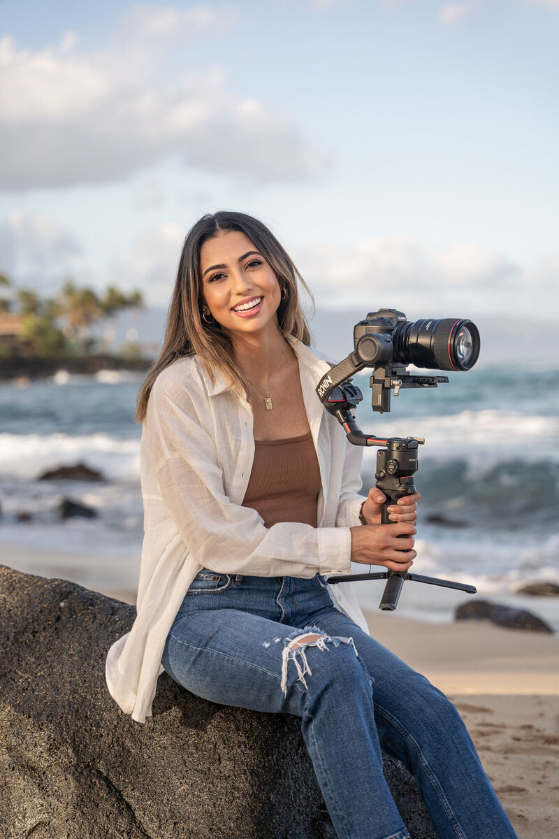 Brand photography in Hawaii of woman holding camera, by Hawaii Adventure Portraits
