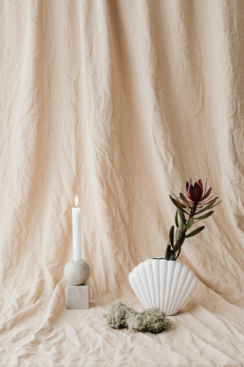 Elegant decorative image with dried flowers and neutral tones accompanying FAQ section about Temple Dreams Studio Showit web design process