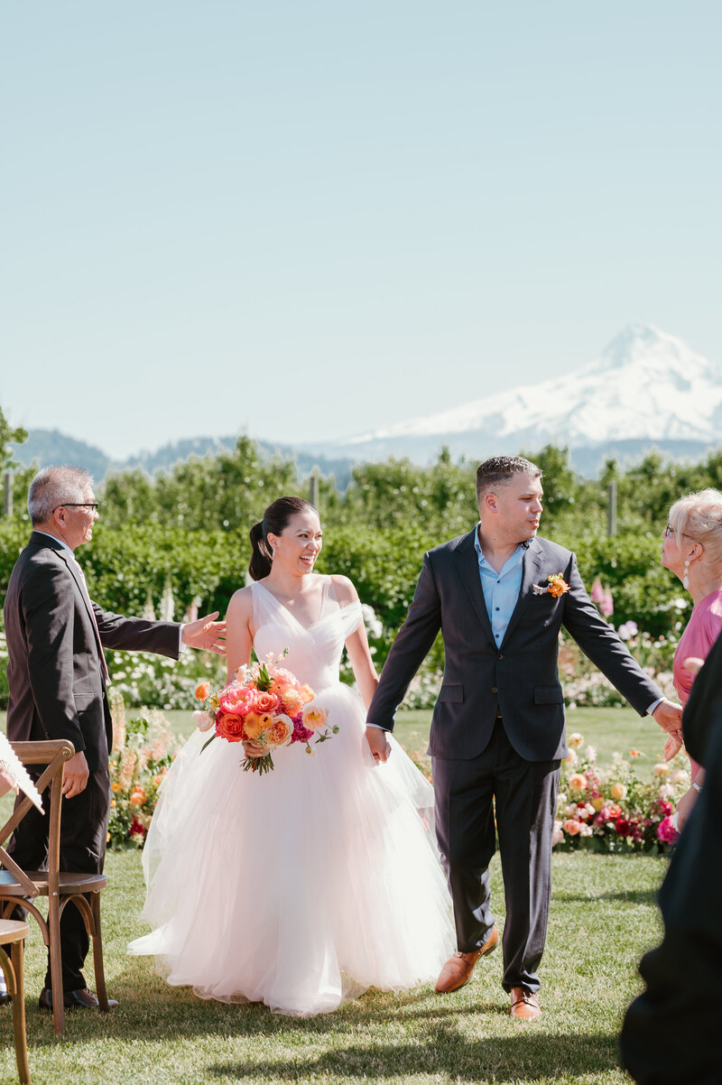 Bride and groom walking down aisle