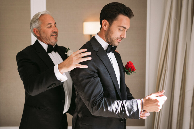 Grooms dad helping with final touches