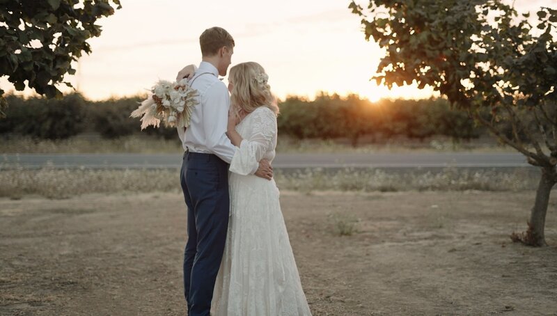 Bride and groom hugging each other on a sunset, enjoying the moment right after they got married by los angeles wedding videographer, Jimmy Shin Films