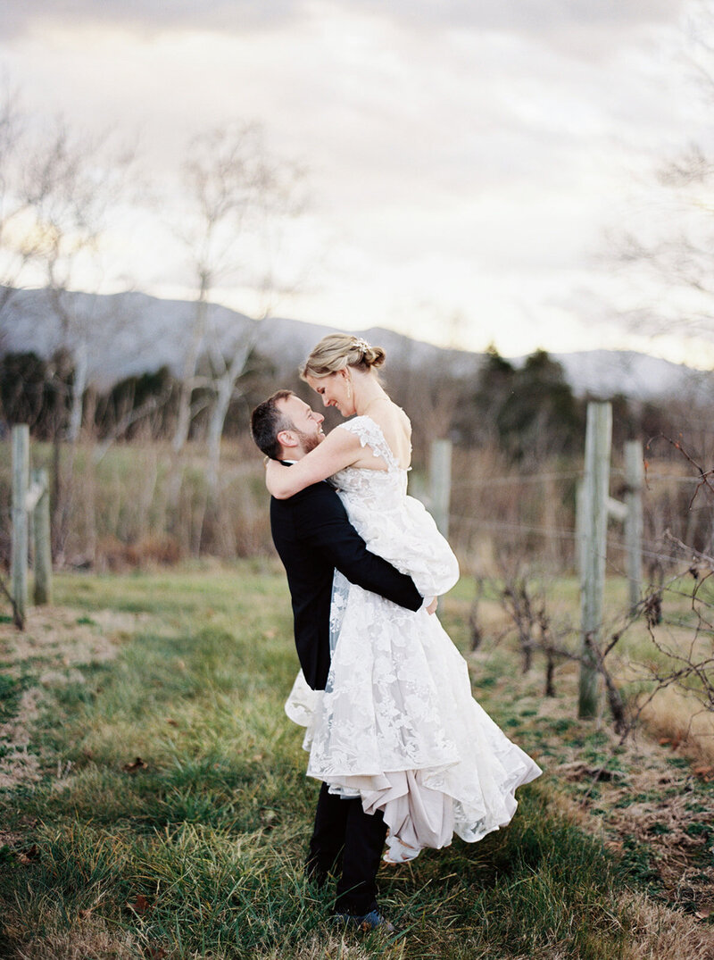 Bride and groom embrace in this image caught on film