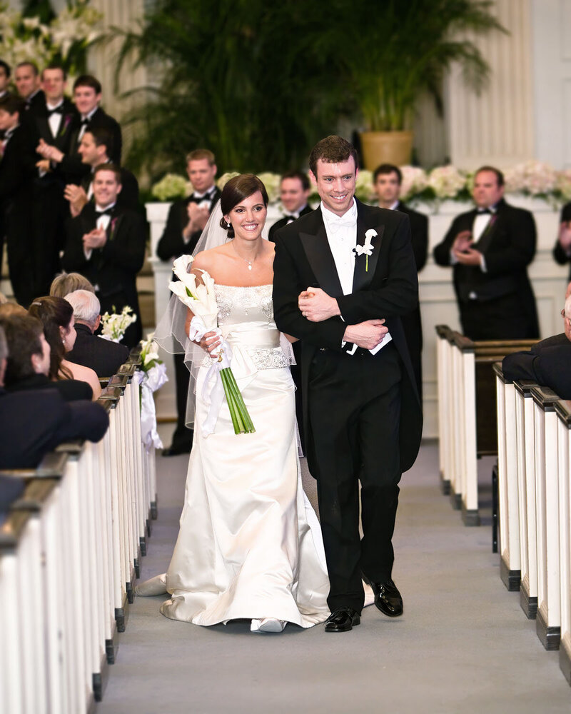 Bride and groom walking down aisle at First Baptist Church in Hattiesburg MS