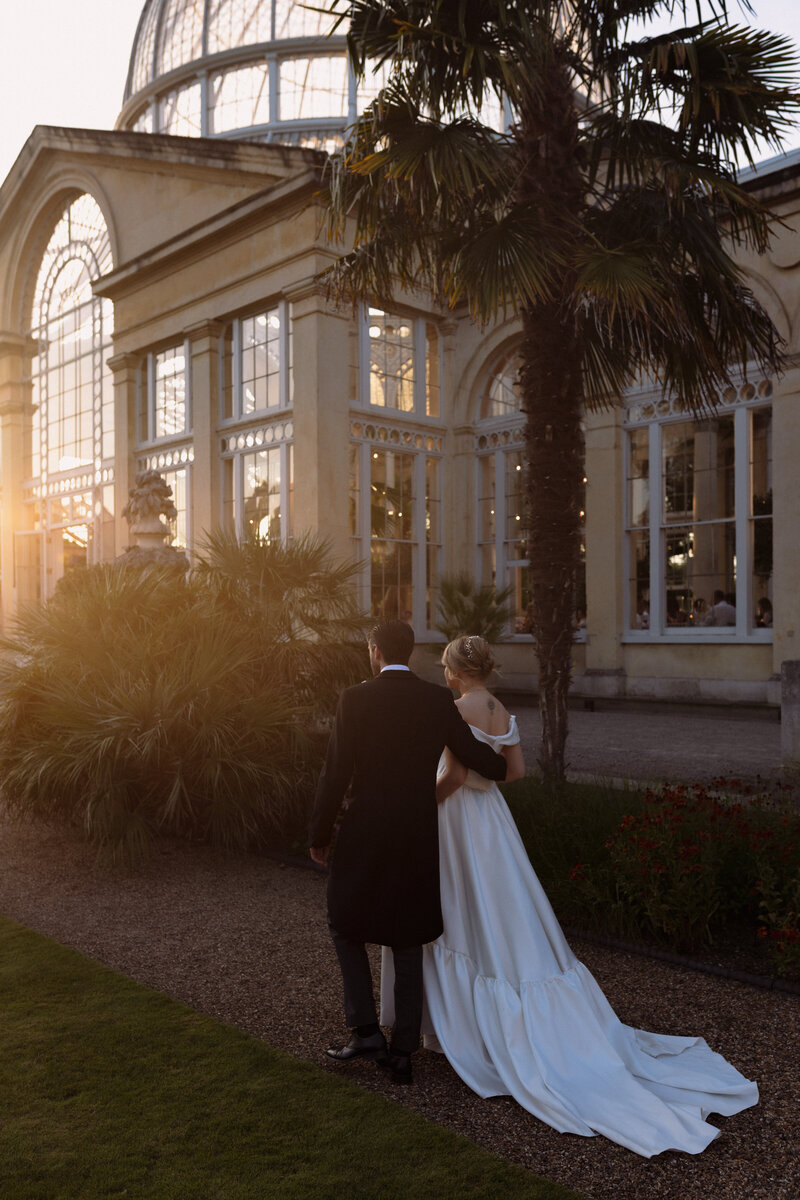 A close angle of a bride admiring her luxury wedding decor at hedor house cotswolds