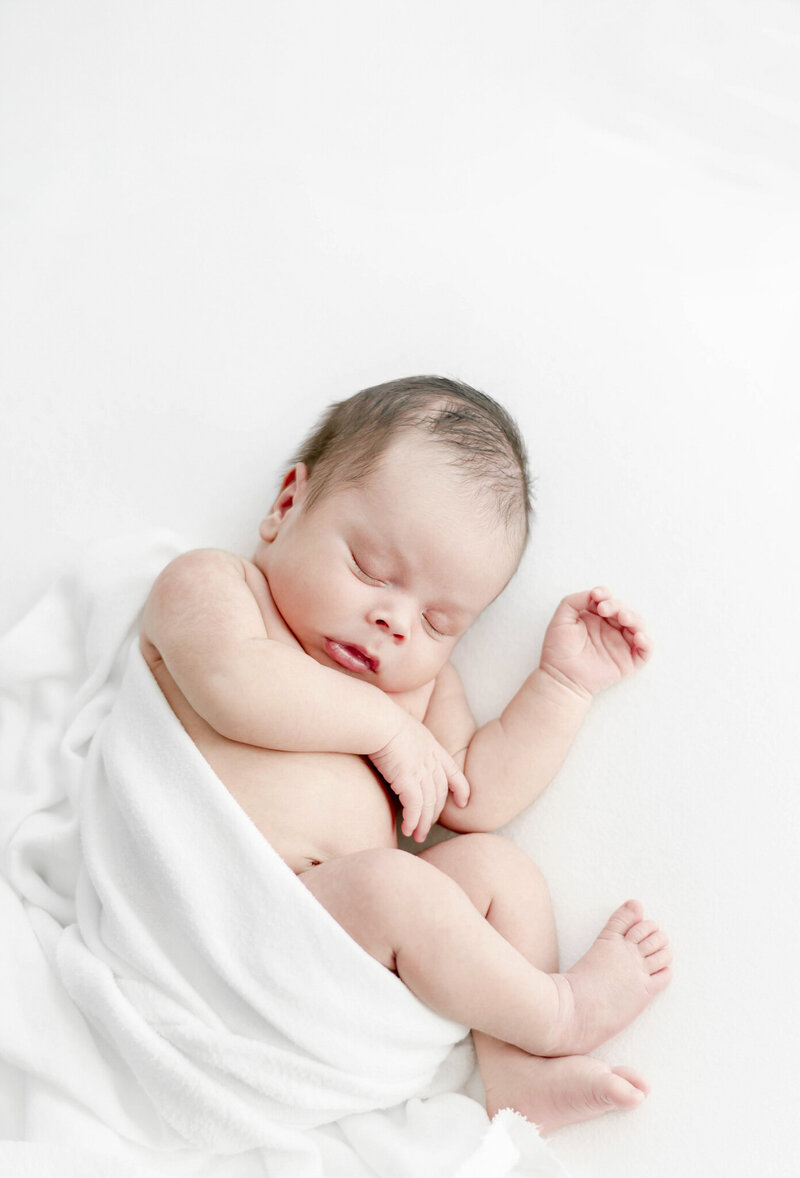 African american newborn baby on a posing bean bag in Nashville newborn photographer, Kristie Lloyd's studio