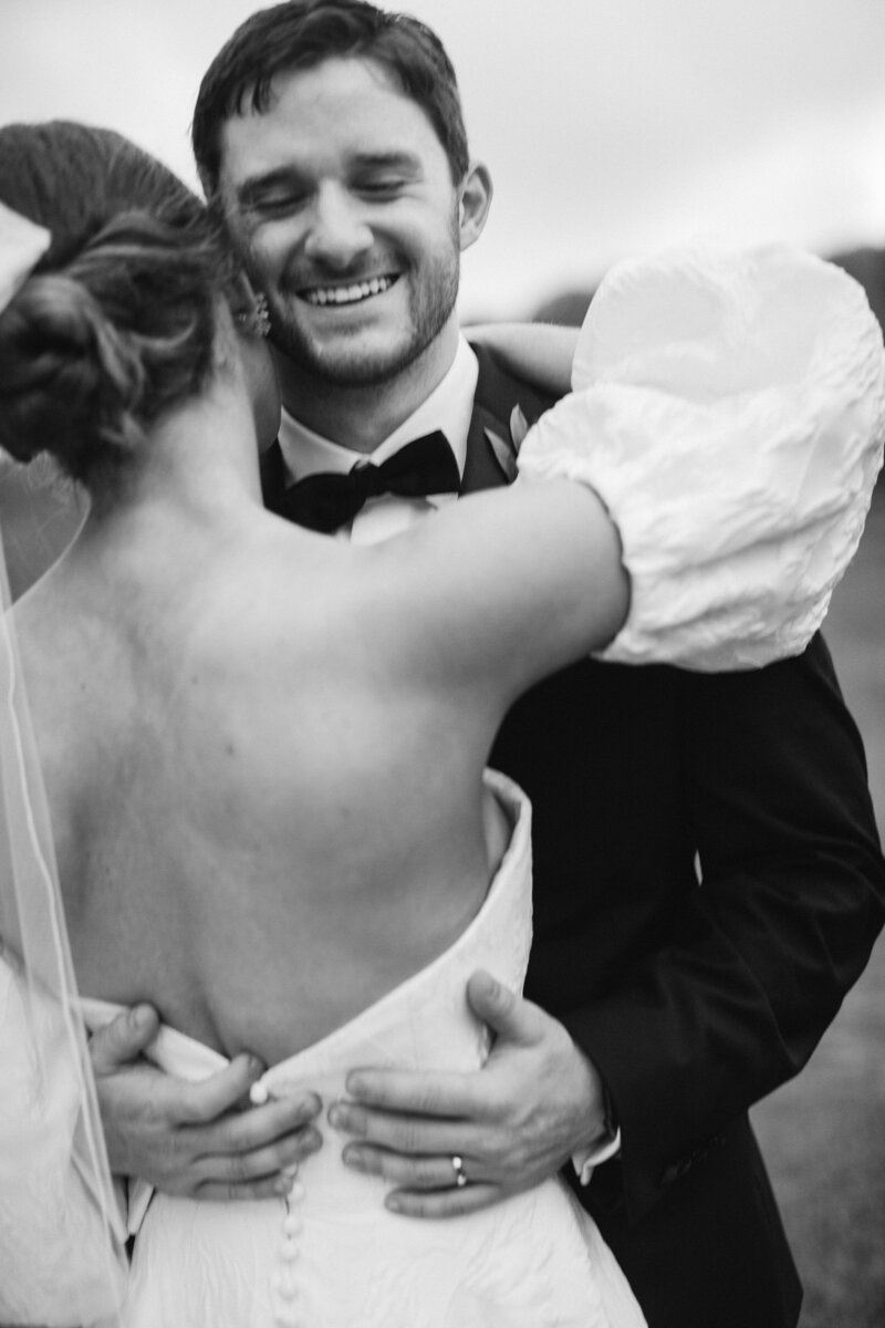 bride-embraces-smiling-groom-55