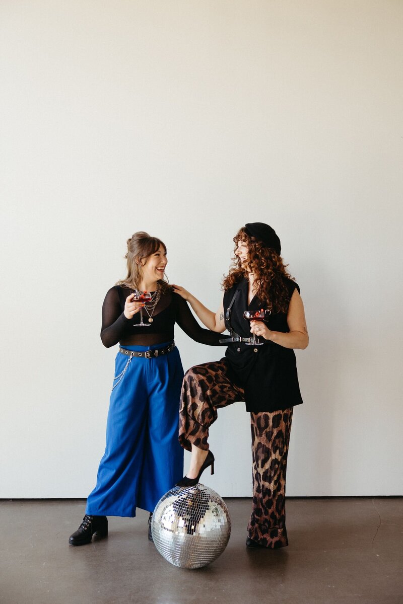 A woman standing with her hands on her waist.