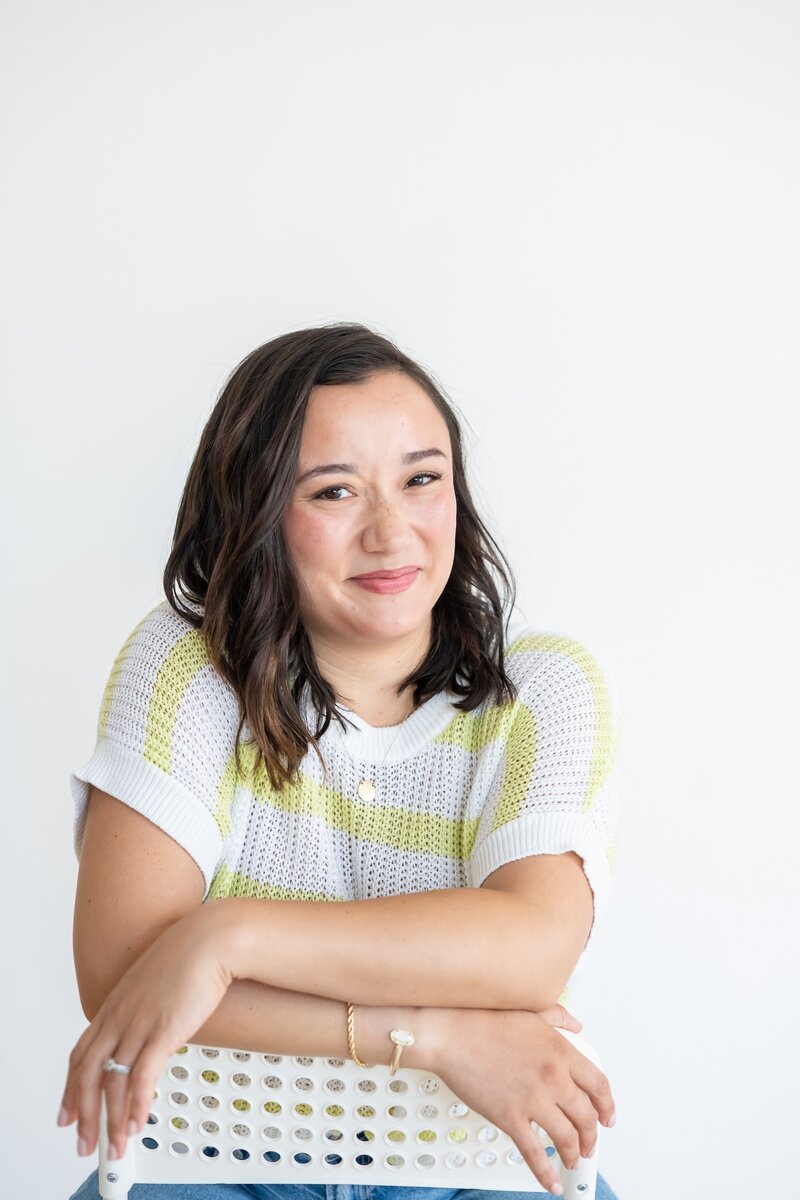 Website copywriter for small businesses sits on couch