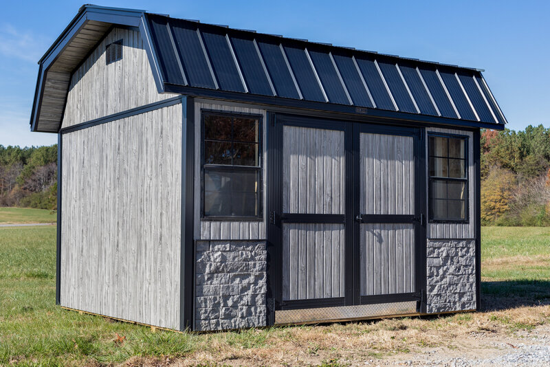 Gray metal shed showing steel siding with a wood look