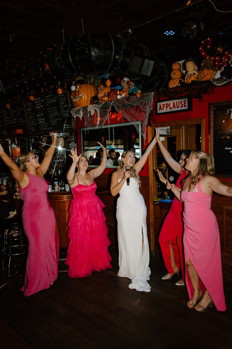 groom and his family dance with him at their reception