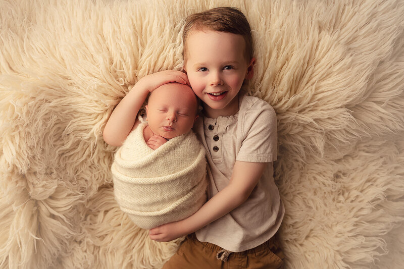 newborn baby with older brother