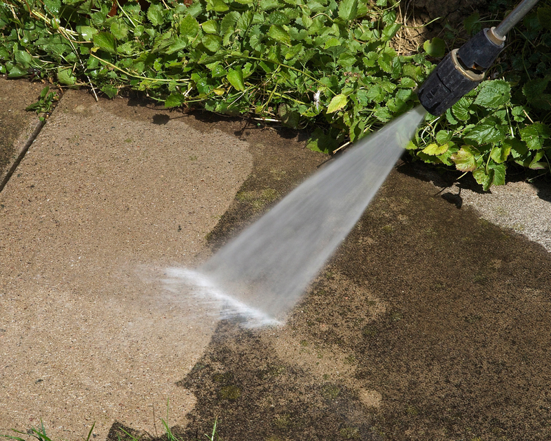 Nate from Nate’s Handyman Co. repairing a wood deck for a homeowner in the Upstate SC. Image shows professional deck repair work including replacing damaged deck boards and reinforcing the structure. Reliable deck repair and deck building services available in Greenville, Travelers Rest, Greer, Taylors, and surrounding Upstate areas