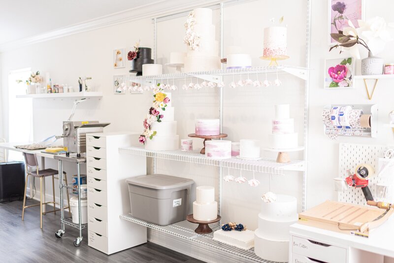 sugar flower studio shelf with display cakes and flowers