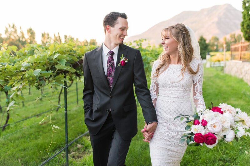 Couple walking through vineyards at Wadley Farms