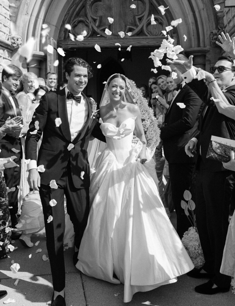 a church petal toss exit during a Detroit, Michigan wedding by film photographer Christina Harrison