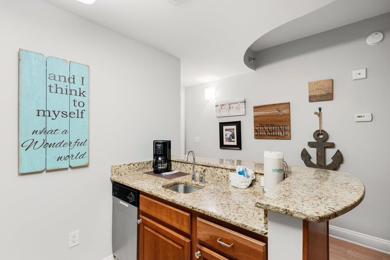 kitchen island with sink and dishwasher