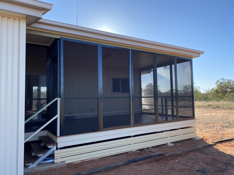 Home featuring bi-fold glass doors, combining space-saving design with aesthetic appeal.
