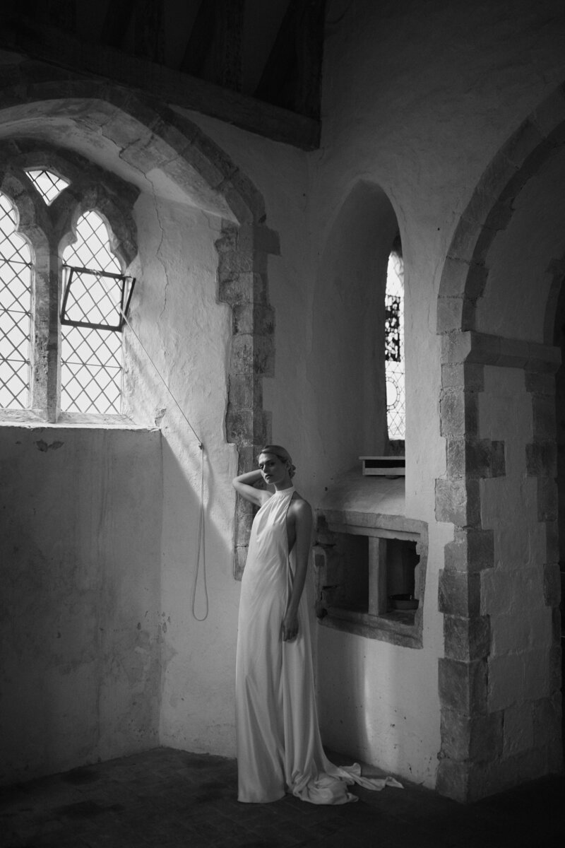 British designer silk wedding dress, bride wearing long, high neck bridal gown in church