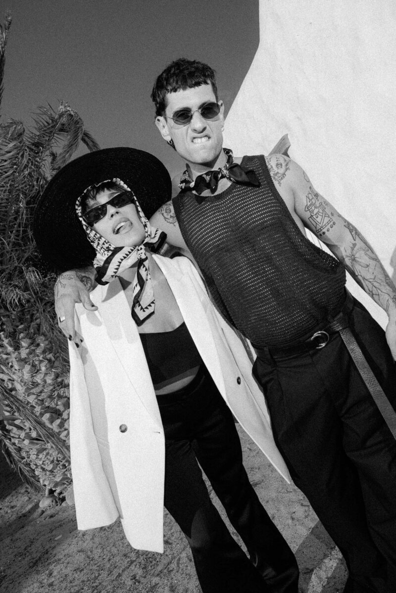 Fashion forward couple wearing hat and sunglasses at Canary Islands Spain.
