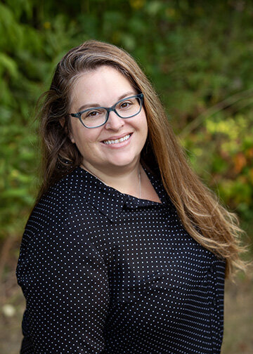 Young woman business professional headshot  outdoors