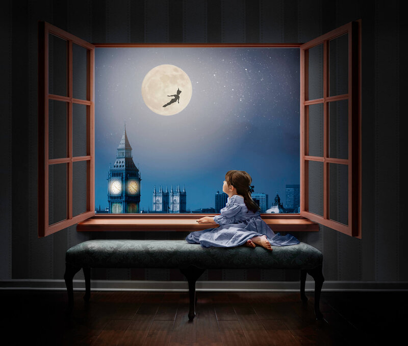 A litte girl dressed a  Wendy waiting by the window for peter pan who is flying past the moon created by an Asheville NC Photographer