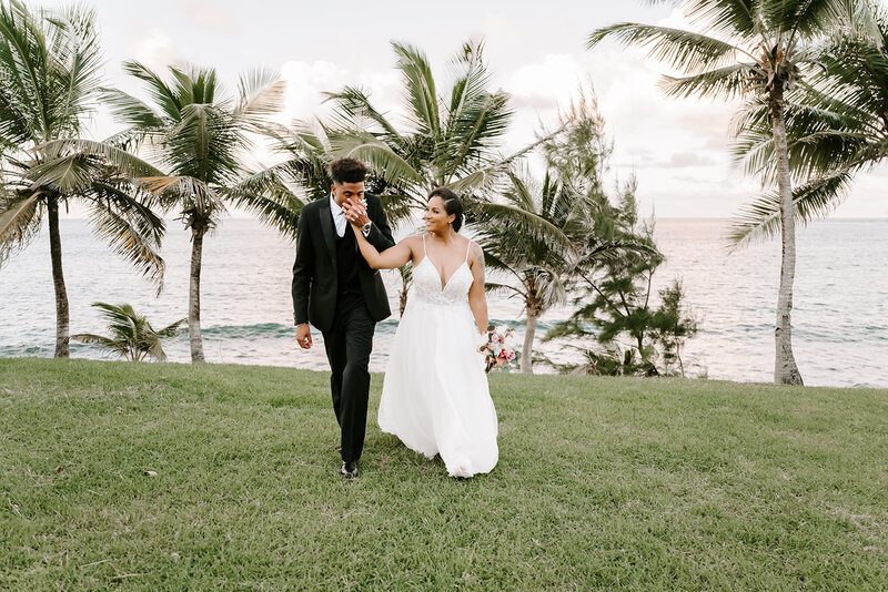 Bride and Groom kissing with cathedral in background