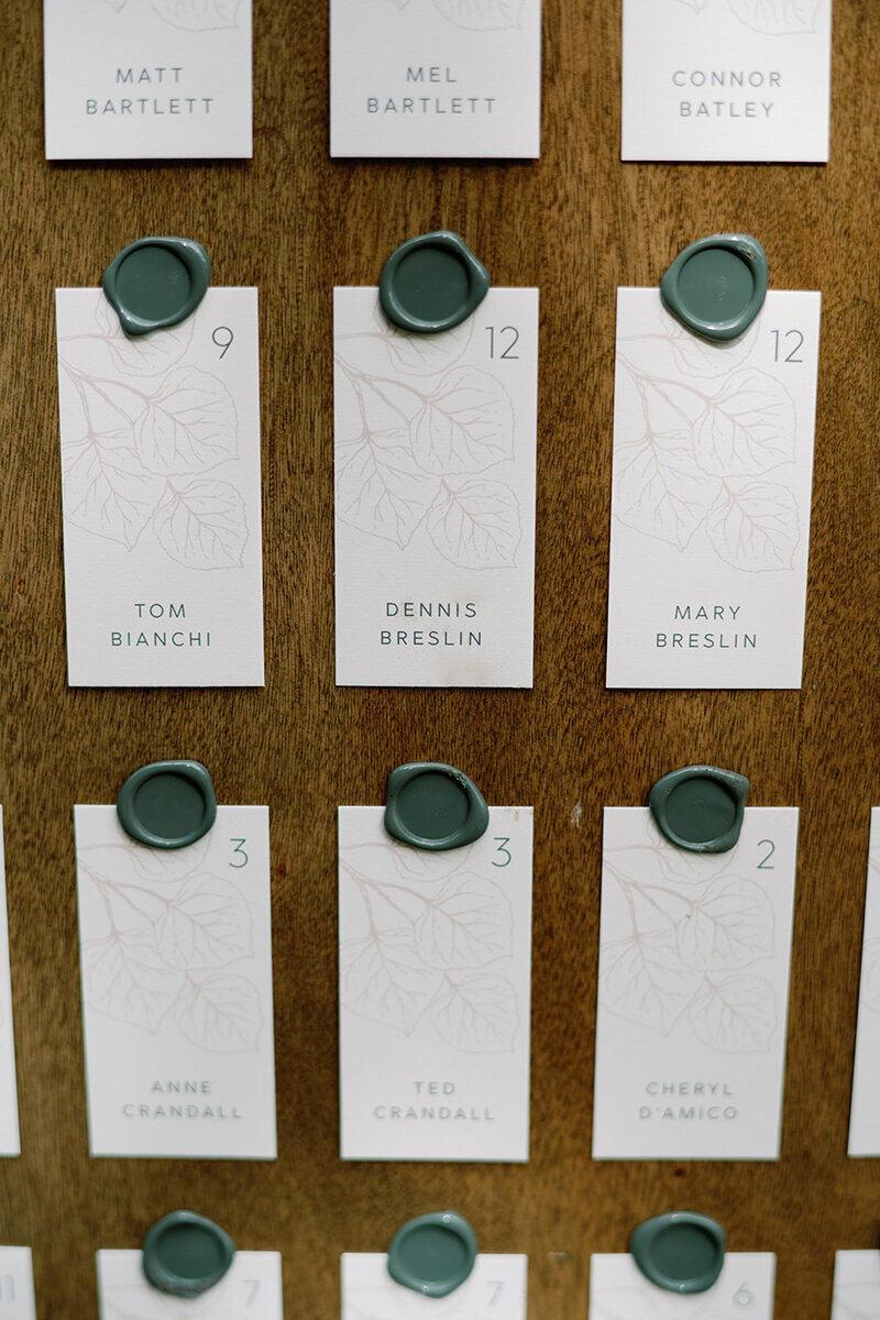 Aspen leaves escort card with wax seal