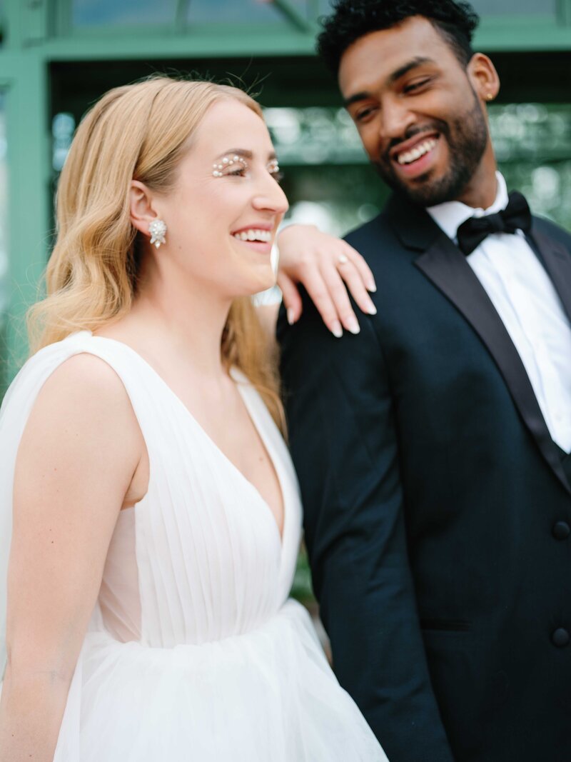 bride and groom smiling and laughing at Morais Vineyards and Winery, wedding venue in Virginia