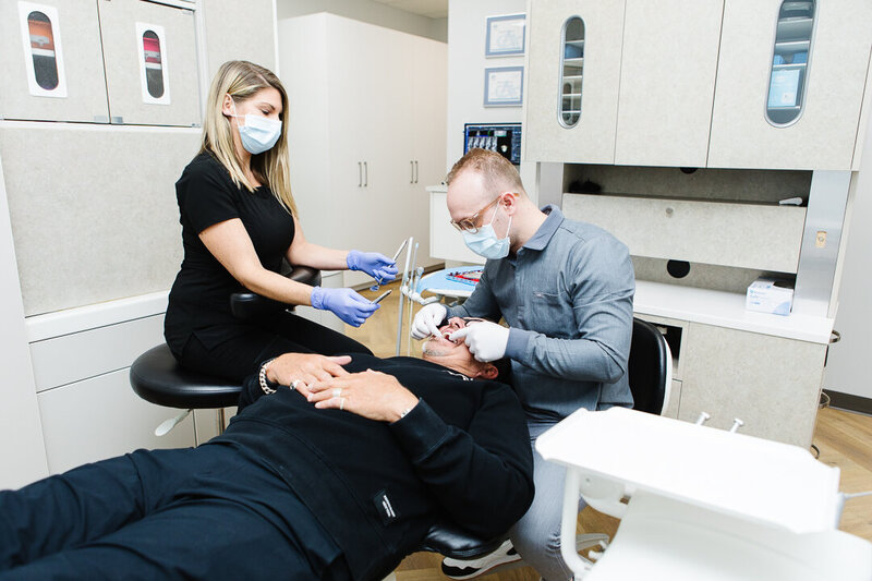 Sleep apnea dentist at Peak Prosthodontics performing a procedure using a custom-fit oral appliance to help patients breathe and sleep better without a CPAP machine. Serving Lethbridge and surrounding cities in Southern Alberta including Medicine Hat.