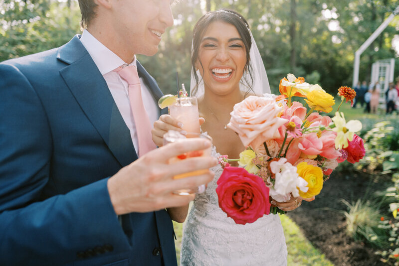 couple standing in front of car on wedding day