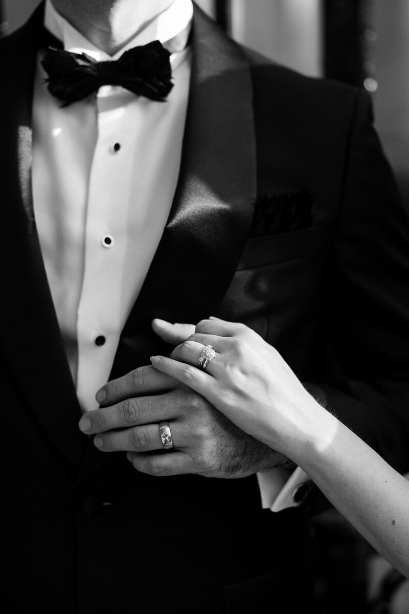 Bride & groom against fabric backdrop