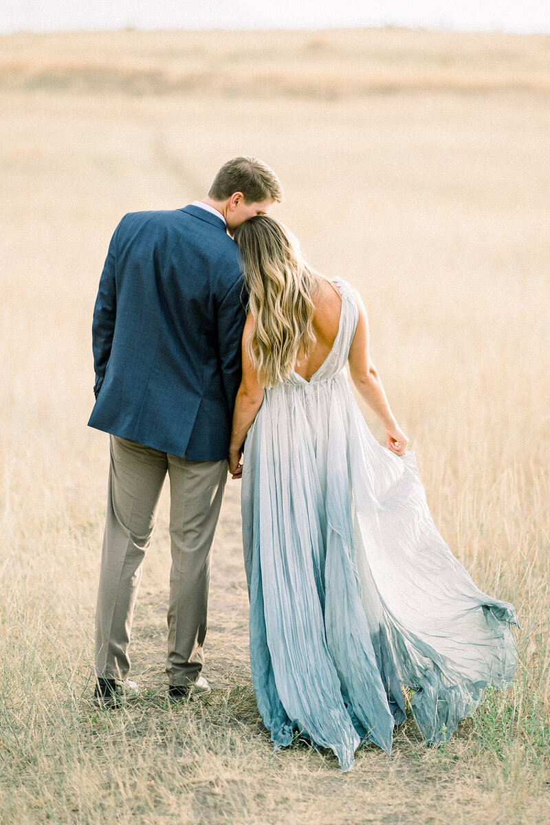 A picturesque engagement session in the golden fields of Kestrel Park in Santa Ynez, California, captured by Tiffany Longeway Photography.