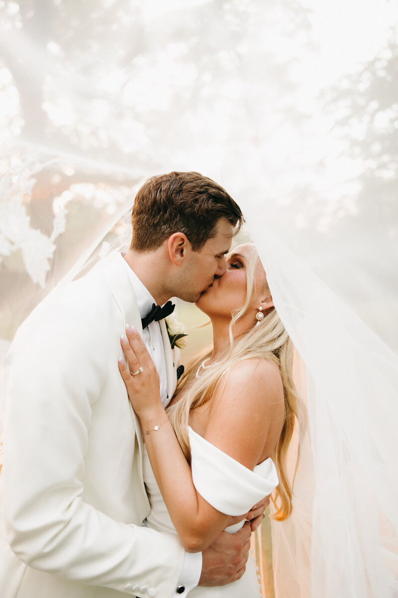 man and woman gazing at each other on their wedding day