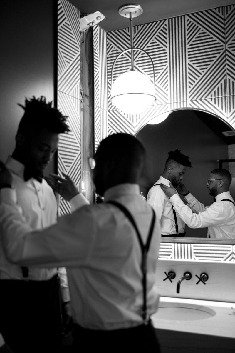 Grooms getting ready together for their wedding at the tinsmith in Madison Wisconsin Q Jancola