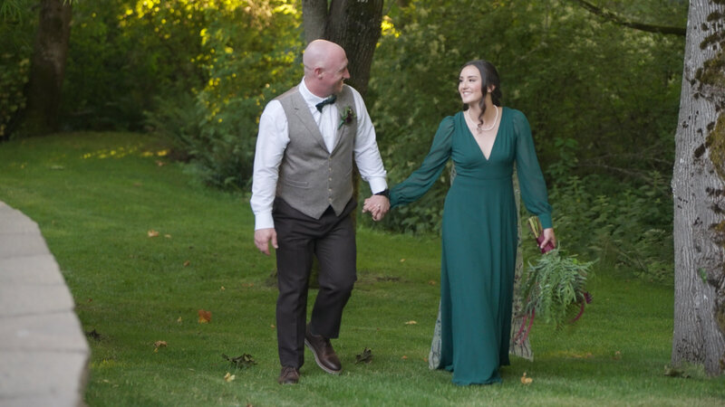bride smiling while holding bridal bouquet