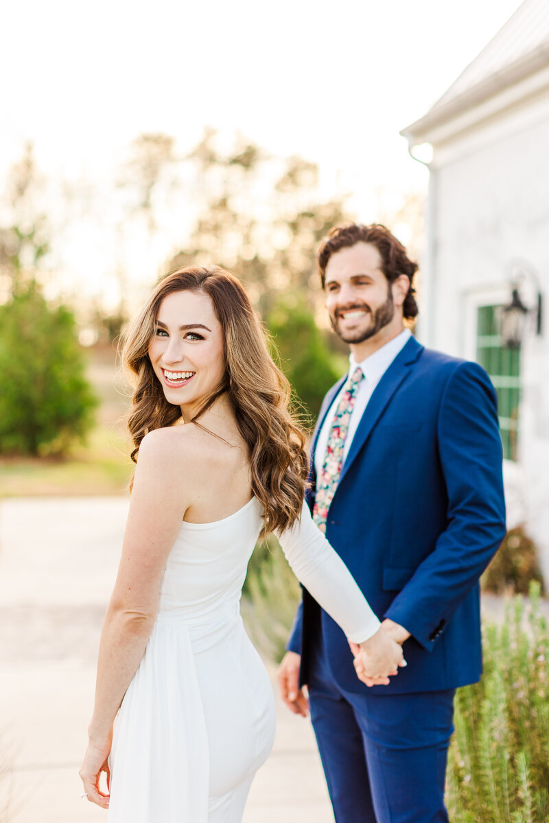 a woman holding hands with her fiance