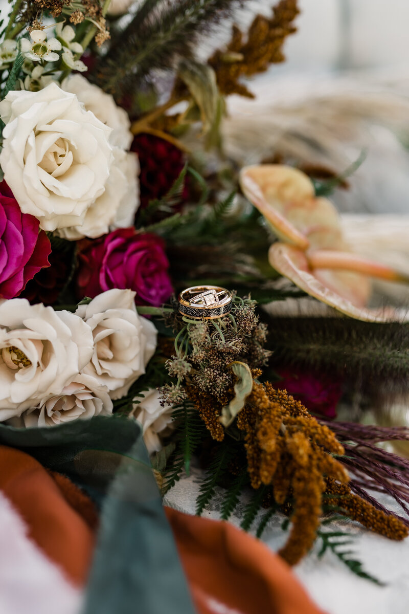 Ring shot with boho wedding bouquet