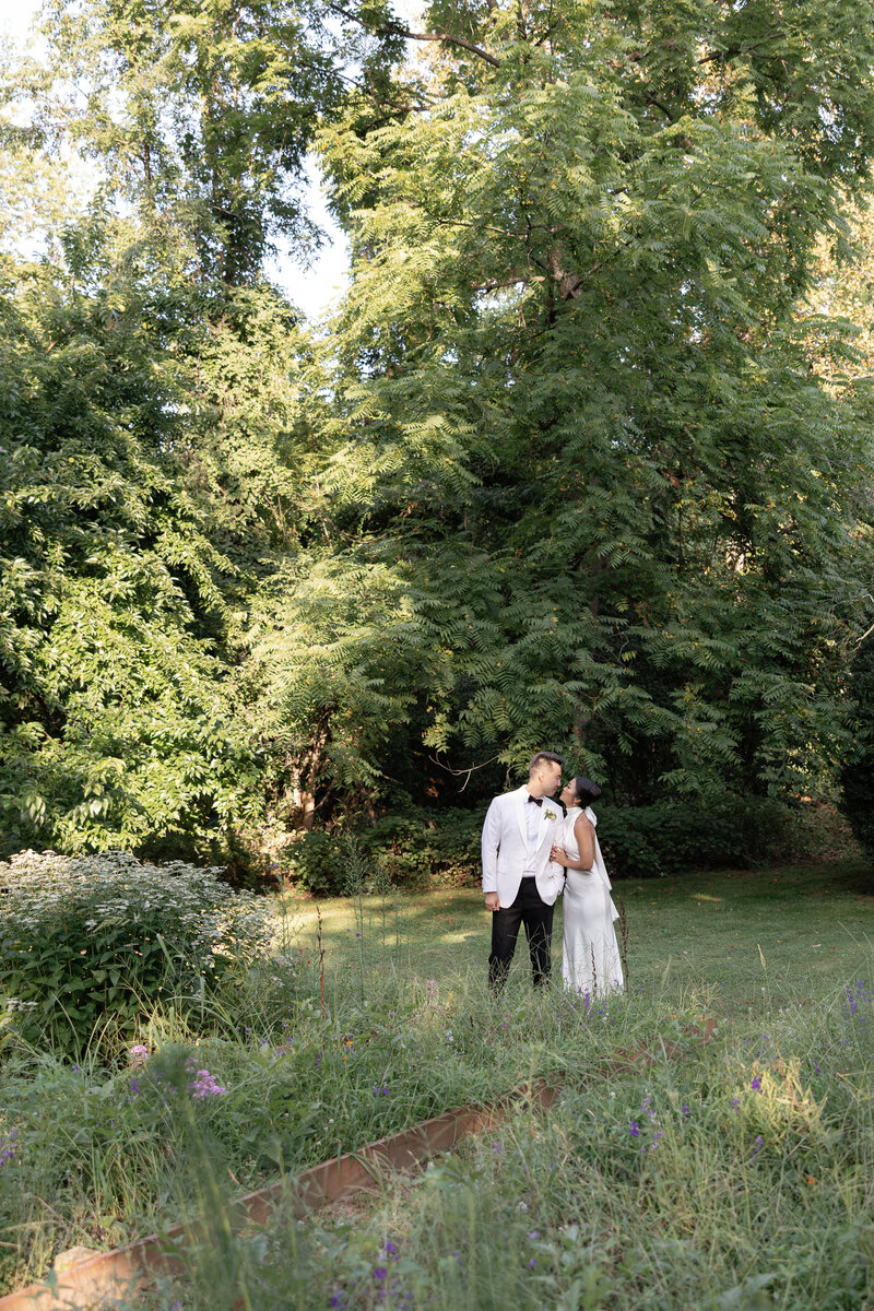 bride and groom embracing on stairs at elopement