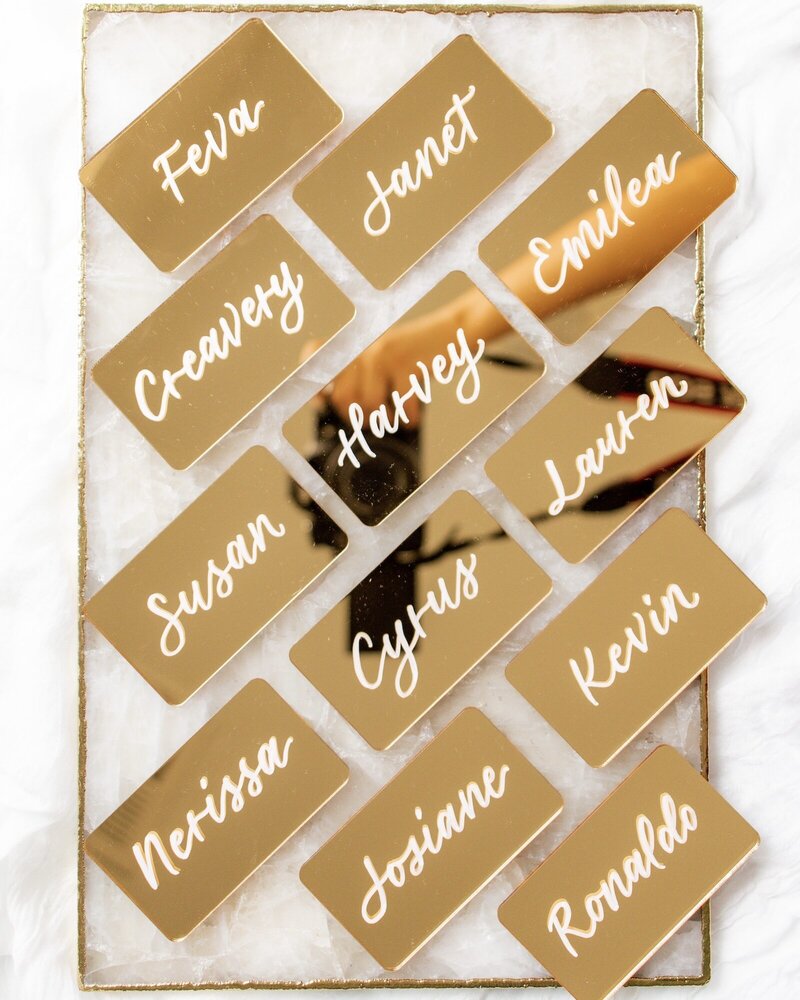 Mirrored gold rectangular place cards for a glamorous wedding