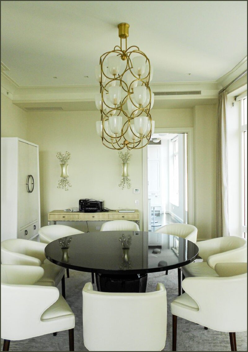 Contemporary penthouse dining room with art lamp