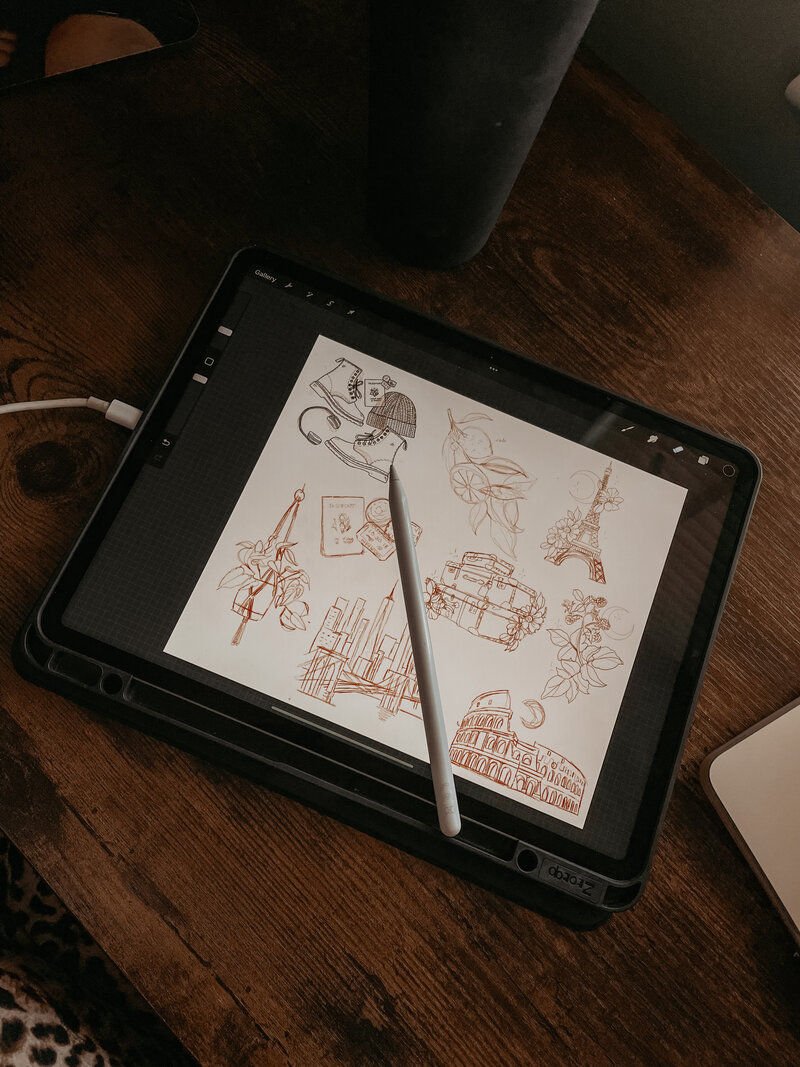 Ipad featuring sketches of custom illustrations for Photography Business