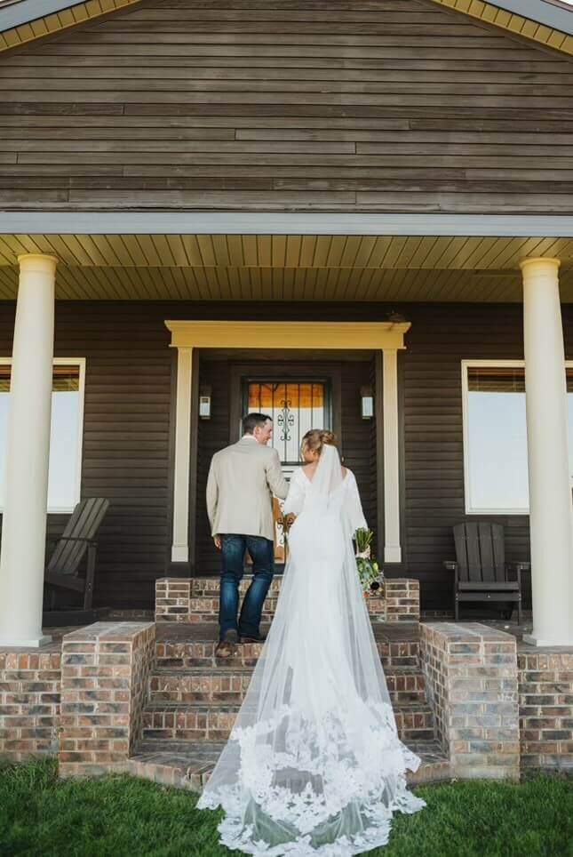 Bride and groom at Hanging H wedding venue front porch