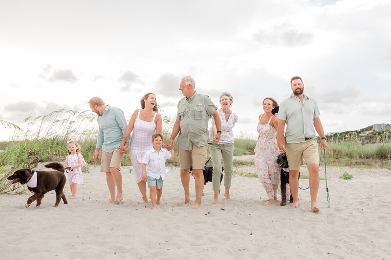 Three generations photographed at Edisto Island South Carolina in natural light.  They are wearing casual clothing and near beach photography