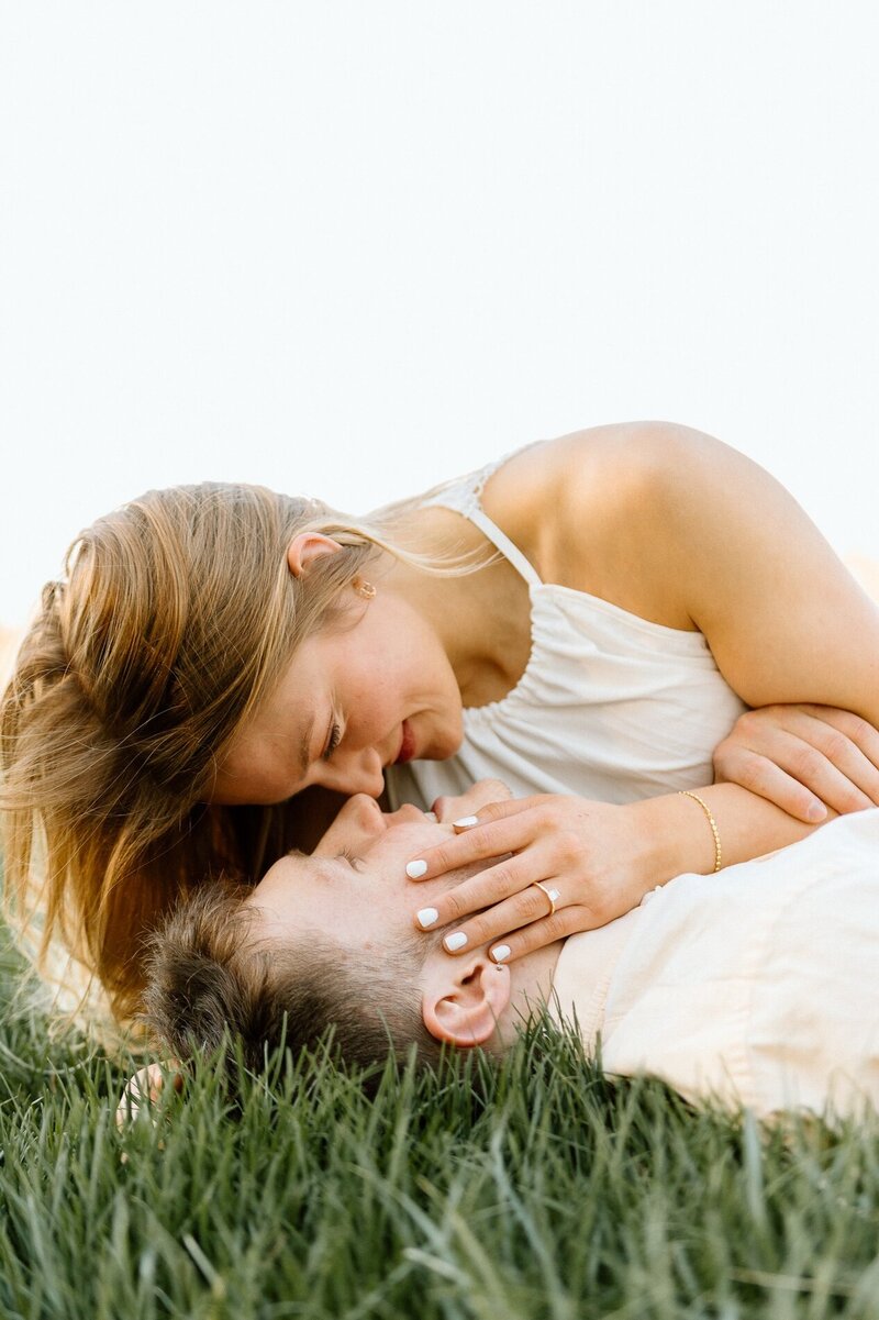 couple embrace in field in kansas city missouri